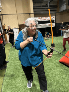 a woman holding a bow and arrow