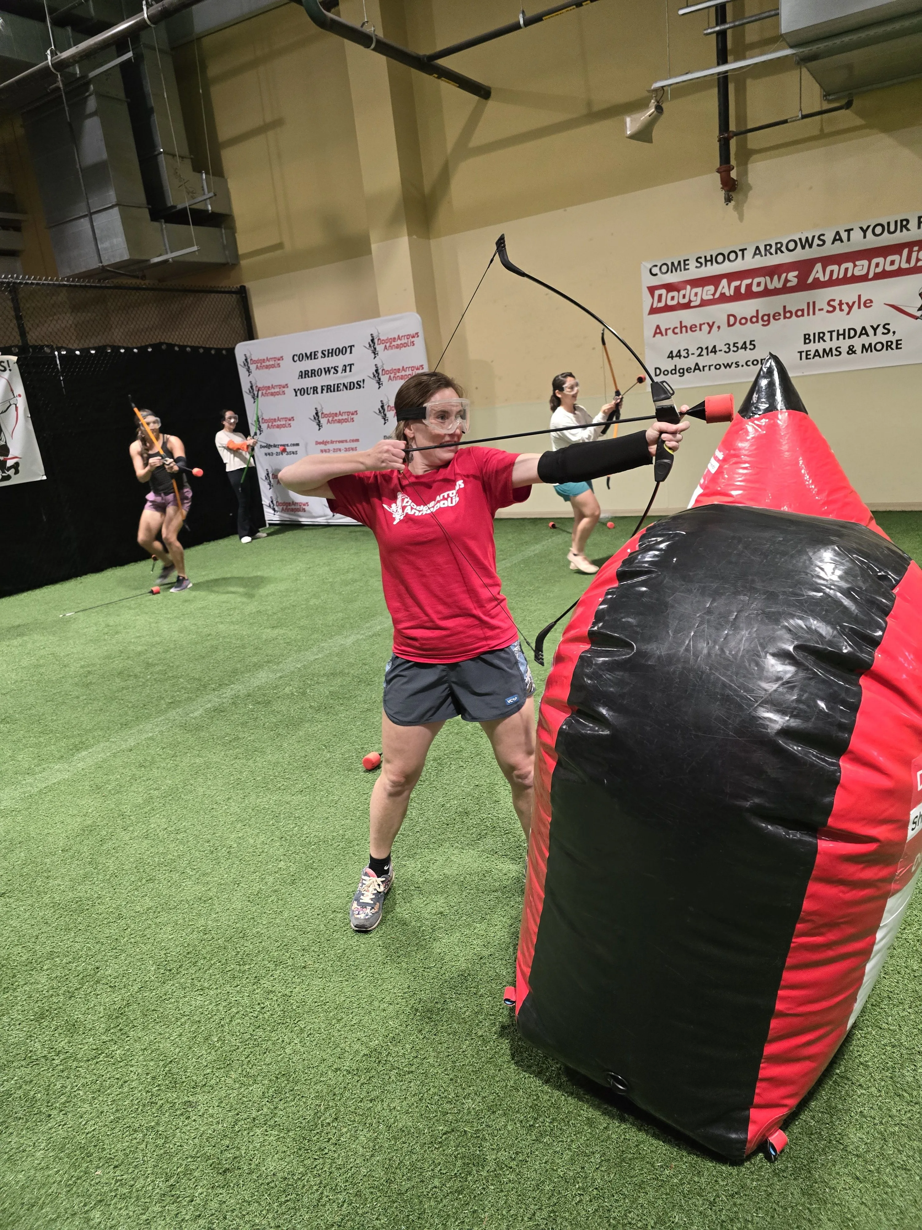 Adult playing arrow tag at DodgeArrows Annapolis