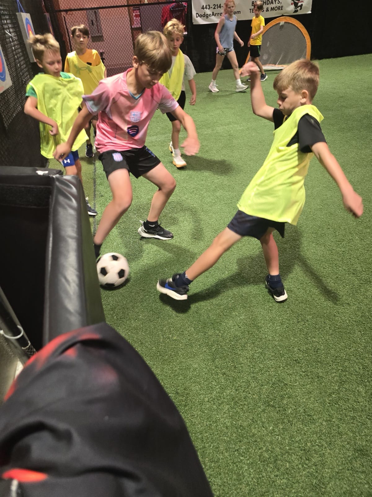 Kids playing kickball at DodgeArrows summer camp